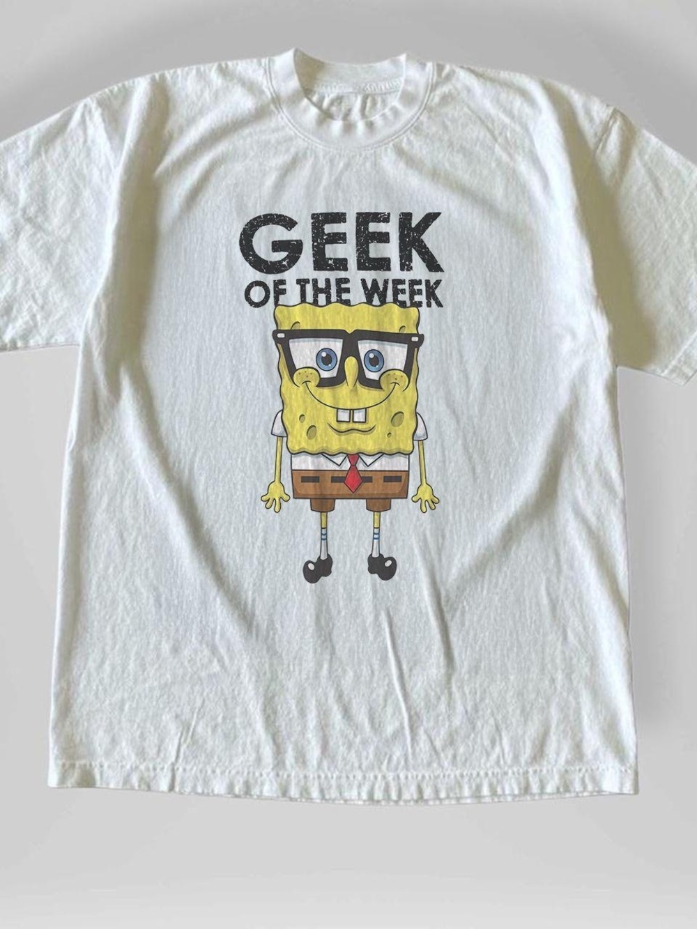 Gildan White Tee with Yellow Cartoon 'Geek of the Week' Graphic